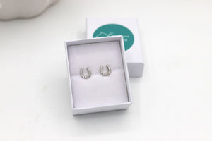 Close up of Sterling silver horseshoe earrings - equestrian jewellery Australia