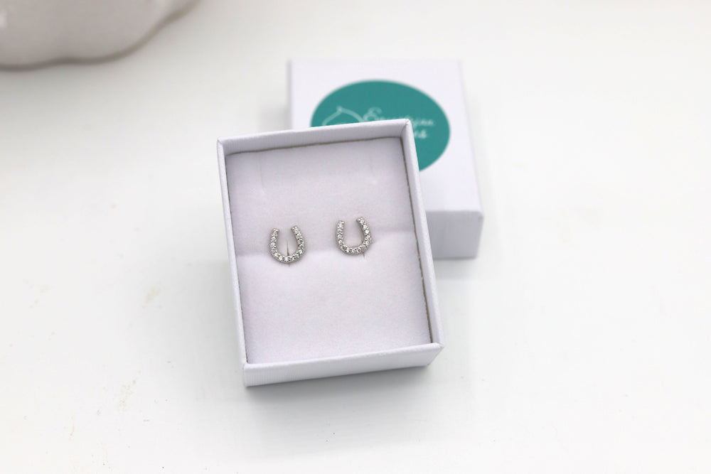 Close up of Sterling silver horseshoe earrings - equestrian jewellery Australia