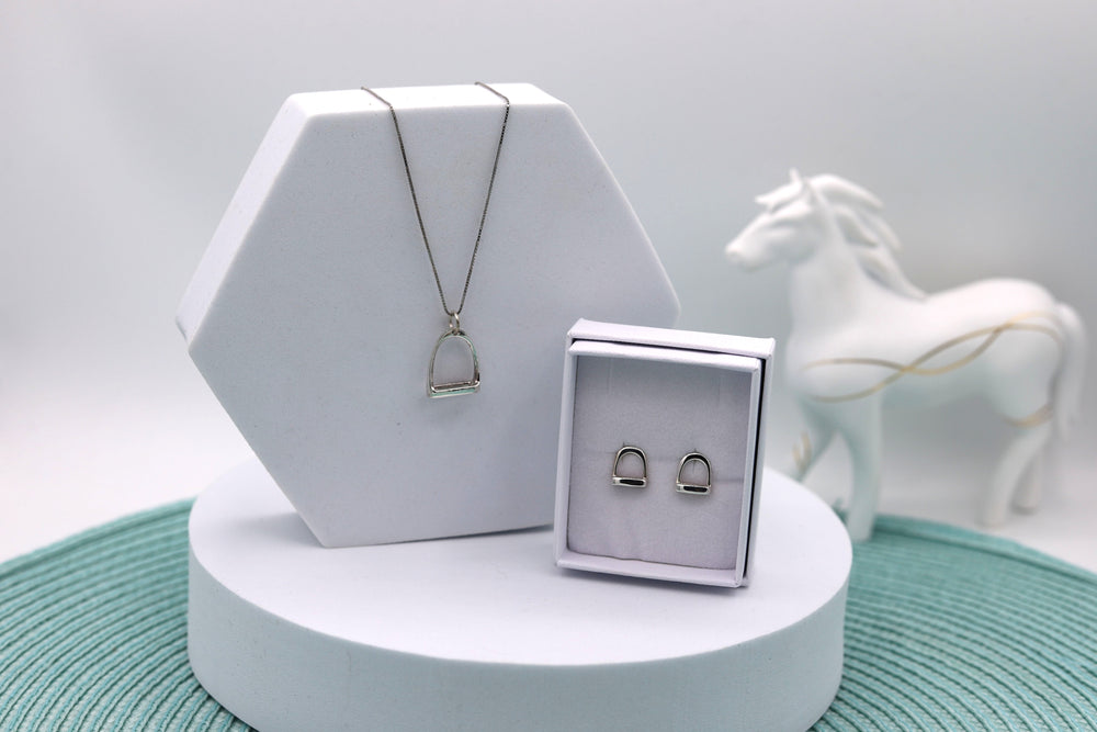 A Sterling silver jewellery set consisting of a Sterling silver stirrup necklace and Sterling silver stirrup ear studs, a perfect gift set for a horse lover