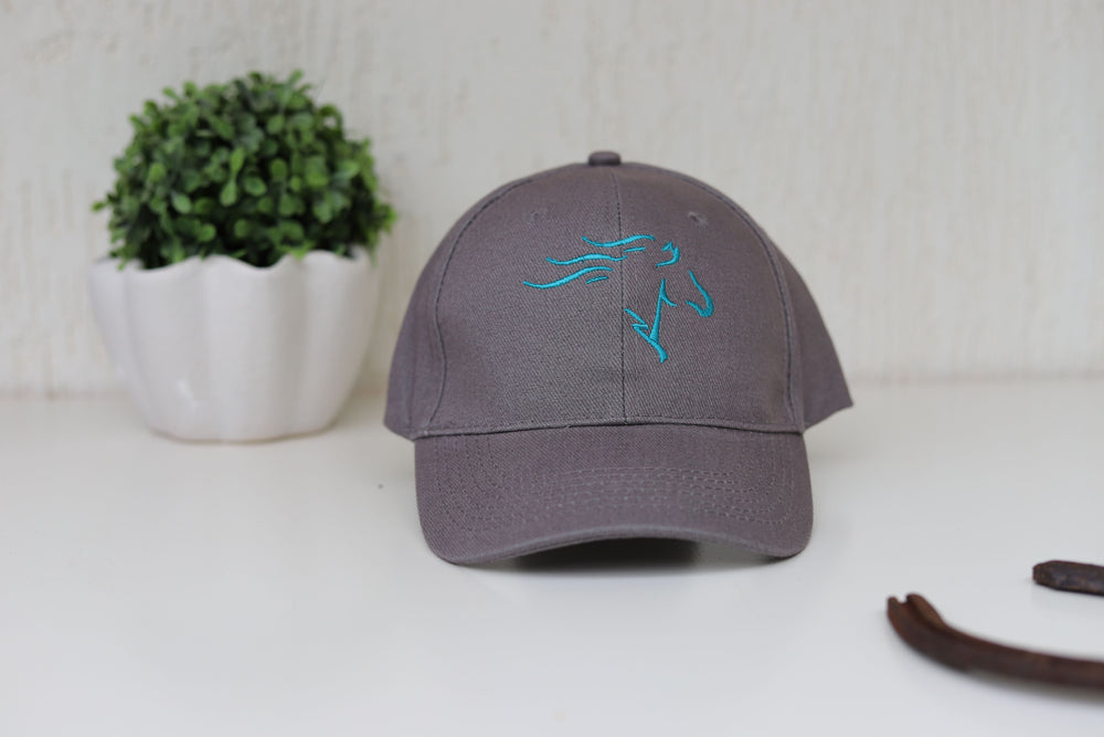 A grey baseball cap with a teal embroidered horse head on the front - perfect equestrian gift