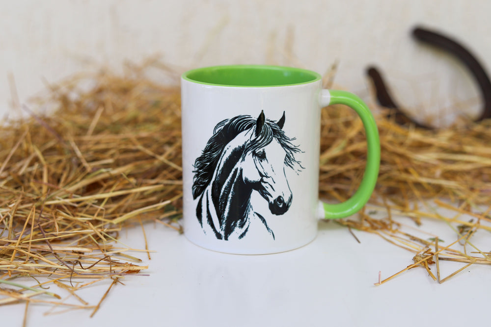 A white ceramic mug with light green trim displaying a horse head sketch in black - horse gifts Australia