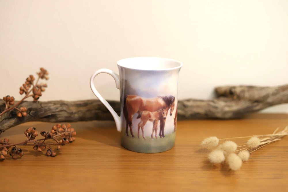 Front view of horse design mug from the Mares and Foals collection featuring a mare and foal in a paddock