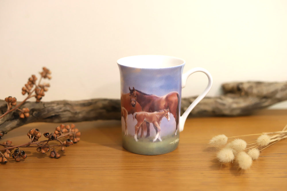 Back view of horse design mug from the Mares and Foals collection featuring a mare and foal in a paddock