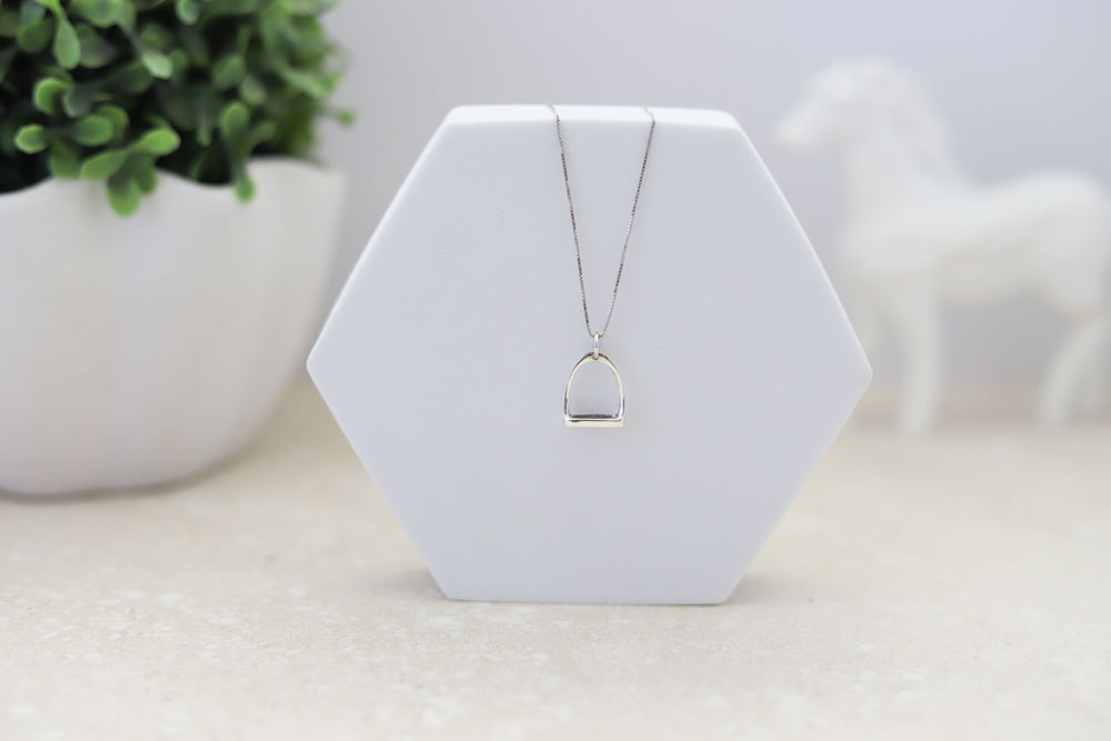A sterling silver stirrup pendant with a  Sterling silver, rhodium plated chain - the perfect Equestrian gift